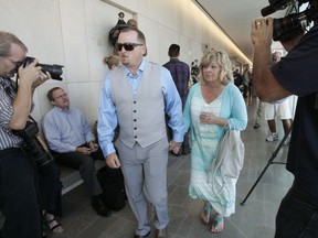 FILE - In this June, 15, 2015, file photo, Michael McStay, brother of the victims, and Susan Blake, their mother, arrive at court for the preliminary hearing for accused killer Chase Merritt in San Bernardino, Calif. Opening statements are expected Monday, Jan. 7, 2018,  in the trial of Merritt for the murders of Joseph McStay, McStay's wife Summer and their 3- and 4-year-old sons. The family disappeared from their San Diego County home in 2010. Three years later, their bodies were found in a remote desert location.