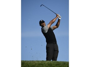 Tiger Woods hits his tee shot on the 15th hole during the second round of the Farmers Insurance Open golf tournament on the North Course at the Torrey Pines on Friday, Jan. 25, 2019, in San Diego.