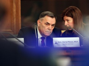 House Speaker Darryl Plecas speaks with Kate Ryan-Lloyd acting clerk of the house during a Legislative Assembly Management Committee meeting in the Douglas Fir room at Legislature in Victoria, B.C., on Monday, January 21, 2019.