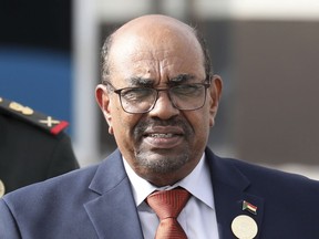 In this July 2, 2018 file photo, Sudanese President Omar al-Bashir leaves the African Union summit, in Nouakchott, Mauritania. Sudan's president has ordered an investigation into "recent events" in the country, a reference to two weeks of violent protests against his 29-year rule. The country's state news agency, reported late on Monday, Dec. 31, 2018, that al-Bashir tasked Justice Minister Mohammed Ahmed Salem with leading the probe committee. The move likely reflects efforts by al-Bashir to placate popular anger over his autocratic rule and economic policies.