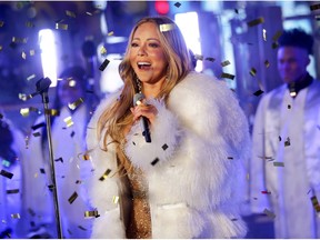 FILE - In this Dec. 31, 2017 file photo, Mariah Carey performs at the New Year's Eve celebration in Times Square in New York. Carey, one of the world's most celebrated artists, is performing in Saudi Arabia for the first time, but there's a growing chorus of Saudi women calling on her to cancel the concert in support of detained women's rights activists. Activists say her concert is an attempt by the government to polish its image after the Oct. 2 killing of Saudi critic Jamal Khashoggi inside the Saudi Consulate in Istanbul.