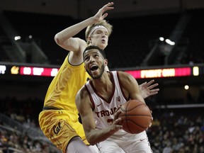 Southern California's J'Raan Brooks, right, looks to shoot as California's Connor Vanover defends during the first half of an NCAA college basketball game Thursday, Jan. 3, 2019, in Los Angeles.