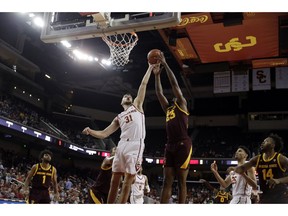 Southern California forward Nick Rakocevic (31) works for a rebound against Arizona State forward Romello White (23) during the first half of an NCAA college basketball game Saturday, Jan. 26, 2019, in Los Angeles.