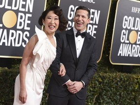 Hosts Sandra Oh, left, and Andy Samberg arrive at the 76th annual Golden Globe Awards at the Beverly Hilton Hotel on Sunday, Jan. 6, 2019, in Beverly Hills, Calif.