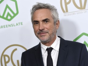 Alfonso Cuaron arrives at the Producers Guild Awards on Saturday, Jan. 19, 2019, at the Beverly Hilton Hotel in Beverly Hills, Calif.