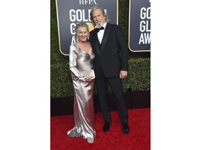 Jeff Bridges, right, and Susan Geston arrive at the 76th annual Golden Globe Awards at the Beverly Hilton Hotel on Sunday, Jan. 6, 2019, in Beverly Hills, Calif.