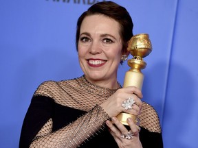 Olivia Colman poses in the press room with the award for best performance by an actress in a motion picture, musical or comedy for "The Favourite" at the 76th annual Golden Globe Awards at the Beverly Hilton Hotel on Sunday, Jan. 6, 2019, in Beverly Hills, Calif.