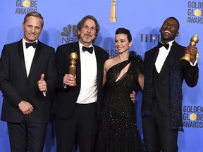 Viggo Mortensen, from left, Peter Farrelly, Linda Cardellini and Mahershala Ali, winner of the award for best performance by an actor in a supporting role in any motion picture for "Green Book", pose in the press room with the award for best motion picture, musical or comedy for "Green Book" at the 76th annual Golden Globe Awards at the Beverly Hilton Hotel on Sunday, Jan. 6, 2019, in Beverly Hills, Calif.