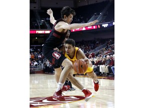 Southern California's Derryck Thornton, right, drives against Stanford's Cormac Ryan during the first half of an NCAA college basketball game Sunday, Jan. 6, 2019, in Los Angeles.