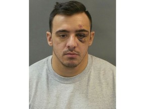 FILE - This Jan 28, 2019 booking photo released by St. Louis Police Department shows officer Nathaniel Hendren. Hendren was charged with involuntary manslaughter in the death of another officer, Katlyn Alix. Police say they were playing with guns when one went off. (St. Louis Police Department via AP, File)