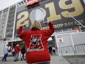 Sonya Snyder makes her way to Levi's Stadium before the NCAA college football playoff championship game between Alabama and Clemson Monday, Jan. 7, 2019, in Santa Clara, Calif.