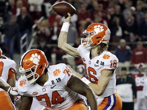 Clemson's Trevor Lawrence throws during the first half the NCAA college football playoff championship game against Alabama, Monday, Jan. 7, 2019, in Santa Clara, Calif.