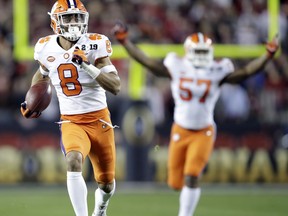 Clemson's A.J. Terrell intercepts a pass for a touchdown during the first half the NCAA college football playoff championship game against Alabama, Monday, Jan. 7, 2019, in Santa Clara, Calif.