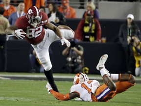 Clemson's K'Von Wallace stops Alabama's Irv Smith Jr. during the first half the NCAA college football playoff championship game, Monday, Jan. 7, 2019, in Santa Clara, Calif.