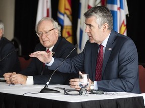 Prince Edward Island Premier Wade MacLauchlan, left, listens as Nova Scotia Premier Stephen McNeil makes a point during a meeting of the Council of Atlantic Premiers in Charlottetown on Wednesday, January 23, 2019. Economic growth and regulatory cooperation were the key discussion points of the one day meeting.