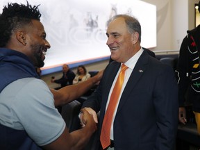 Denver Broncos new head coach Vic Fangio, right, greets wide receiver Emmanuel Sanders after a news conference at the team's headquarters Thursday, Jan. 10, 2019, in Englewood, Colo.