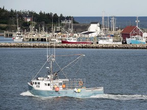 A community on the southwestern coast of Nova Scotia is looking forward to a brighter 2019 after a difficult year that's been bookended by tragedy. A fishing boat heads out the harbour in Yarmouth, N.S., on Wednesday, June 15, 2016.