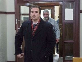 Const. Laurence Gary Basso heads from provincial court in Halifax on December 5, 2018. A Halifax police officer has denied using excessive force in a 2018 incident that left a homeless man injured. Const. Laurence Gary Basso faces charges of assault causing bodily harm and mischief in relation to his notes on the incident, which was caught on videotape.