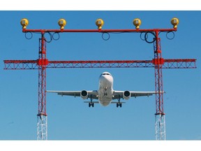 An airplane prepares to land at Pearson International Airport in Toronto, Thursday September 30, 2004. Air safety authorities say the runway setup at Toronto's Pearson International Airport poses a serious risk of crashes.