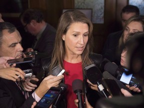 Ontario's Attourney General Caroline Mulroney talks the media at Queens Park, in Toronto on Monday, Nov. 19, 2018. A shortage of adjudicators at the Human Rights Tribunal of Ontario is causing widespread delays that some lawyers say could undermine cases, prolong conflicts and discourage vulnerable people from seeking relief.