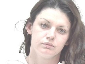 Laetitia Angelique Acera, 25, is shown in this undated police handout photo. Police in Calgary are asking for help to locate a woman facing Canada-wide warrants on 115 charges.The police service says Laetitia Angelique Acera, who is 25, is wanted on charges in Calgary going back to last September. The charges include multiple counts of assault with a weapon, break and enter, fraud under $5,000, motor vehicle theft and theft of mail.