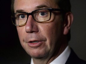 Treasury Board President Scott Brison speaks in the foyer of the House of Commons on Parliament Hill in Ottawa on Wednesday, Sept. 19, 2018. Brison is quitting a political career he loves to spend more time with a cherished family that politics made possible.THE CANADIAN PRESS/Sean Kilpatrick
