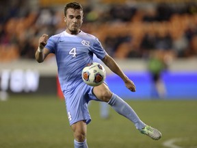 North Carolina's Alex Comsia (4) stops the ball from moving forward while defending during the first half of the NCAA soccer men's College Cup semifinal against Stanford, Friday, Dec. 9, 2016, in Houston. There were many more ups than downs for Comsia in his four years at the University of North Carolina. But as the centre back from North Vancouver awaits Friday's MLS SuperDraft in Chicago, he knows the bumps in the road helped make him who he is today.