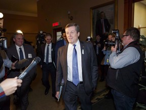 Toronto Mayor John Tory arrives for a meeting with Ontario Premier Doug Ford at Queen's Park in Toronto on December 6, 2018. It seems Netflix is considering creating a production hub in Toronto. Asked whether the video streaming giant is interested in setting up shop in the city, Mayor John Tory suggested to