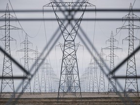 Hydro power lines are shown just outside Winnipeg, Monday, May 1, 2018. Newly released documents say the federal agency created to finance new infrastructure - and alleviate the burden off the public purse - was not supposed to get involved in projects to expand or enhance existing public electricity grids.