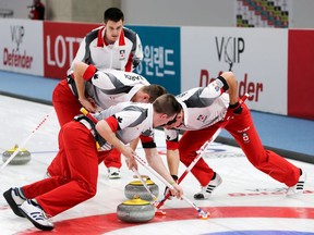 Team Canada's Tyler Tardi, back, shouts instructions to his sweepers during 2017 World Junior Curling Championship action in Gangneung, South Korea on Thursday, Feb. 23, 2017. B.C. skip Tyler Tardi will begin pursuit of a third straight Canadian junior curling title Saturday in Prince Albert, Sask.