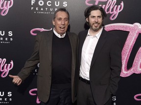 Director Jason Reitman, right, and his father Ivan Reitman arrive at the Los Angeles premiere of "Tully" at Regal Cinemas L.A. Live on April 18, 2018. There's something strange in the Canadian entertainment neighbourhood. The Reitman family, headed by Toronto-raised movie maker Ivan Reitman, is making headlines for some major film and TV projects -- further solidifying their status as a homegrown entertainment dynasty.