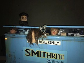 This undated handout photo, provided by the Delta Police department, shows mannequin heads peeping out of a dumpster. A routine patrol of an alley in downtown Ladner, B.C., gave police pause late Monday evening.