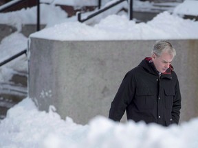 Dennis Oland heads to the Law Courts in Saint John, N.B., on Wednesday, Nov. 21, 2018. Although it was dirty and appeared not to have been cleaned, the car Dennis Oland was driving the evening his father, Richard, was murdered did not produce any suspicious bloodstains, a Saint John court was told Tuesday.