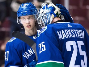 Vancouver Canucks' Elias Pettersson, left, and goalie Jacob Markstrom, both of Sweden, celebrate Vancouver's 5-1 win against the Philadelphia Flyers during an NHL hockey game in Vancouver on December 15, 2018. Vancouver Canucks fans will have to wait to see Elias Pettersson back on the ice. The star rookie skated with his teammates ahead of Wednesday's contest with the Edmonton Oilers, but won't suit up for the game.