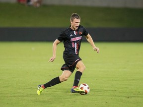 University of Louisville's Adam Wilson is shown during game action against the University of Pittsburgh in this Sept. 21, 2018 handout photo. Adam Wilson was playing Xbox in a Louisville hotel room during the MLS SuperDraft, waiting to move into his new apartment. "I was a week into school. I had already come to terms with myself that I wasn't getting drafted and I was going back to school," said the Scottish midfielder, who has one semester left at the University of Louisville. Then he looked at his phone and saw a text from former Louisville teammate Mohamed Thiaw.