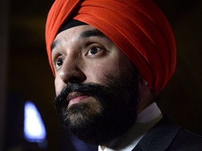 Minister of Innovation, Science and Economic Development Navdeep Bains listens to a question during a press conference on Parliament Hill in Ottawa on Monday, Nov. 26, 2018. The federal government's big-ticket efforts to support high-growth tech firms are offering little for emerging companies that have already outgrown the fledgling start-up phase, according to a new survey of CEOs in Canada's sector.