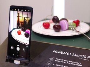 In this Jan. 9, 2018, file photo the Huawei Mate10 Pro phone is displayed at the Huawei booth during CES International in Las Vegas. Saskatchewan's Opposition NDP is calling on the government to investigate any risk posed by Chinese firm Huawei Technologies and the province's main telecom provider.