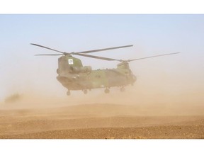 A Canadian Chinook helicopter takes off as it provides logistical support during a demonstration on the United Nations base in Gao, Mali, Saturday, December 22, 2018. Canadian peacekeepers in Mali have launched their second medical evacuation mission in less than a week after a UN armoured vehicle triggered an explosive device Friday, killing two and wounding six others.