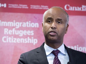 Minister of Immigration Ahmed Hussen makes an announcement in Toronto on January 14, 2019. A new online first-come-first-served application process for reuniting immigrants with their parents and grandparents is being widely condemned as "profoundly discriminatory" after the program opened and closed in less than 10 minutes on Monday.