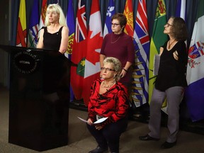 Members of the Thalidomide Survivors Task Group hold a news conference on Parliament Hill, in Ottawa on December 5, 2017. Clockwise from left are Fiona Sampson, Mary Ryder, Alexandra Niblock and Lee Ann Dalling.