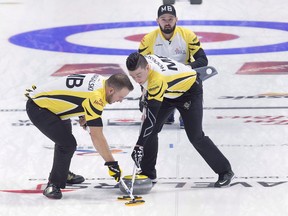 Manitoba skip Reid Carruthers looks on as second Derek Samagalski, left, and lead Colin Hodgson sweep against Nunavut at the Tim Hortons Brier curling championship at the Brandt Centre in Regina on March 4, 2018. Armed with a passionate fanbase, an ever-growing list of elite competitors, a surge in interest after a memorable Winter Olympics and growing penetration in enviable international markets, the sport of curling appears primed for a breakout. Whether the opportunity will be harvested remains up in the air.
