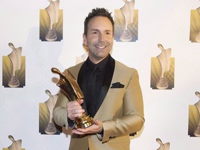 Eric Salvail holds up his trophy for best talk show host at the Gala Artis awards ceremony in Montreal on April 24, 2016.