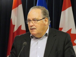 Alberta Government House Leader Brian Mason speaks to reporters at a press conference in Edmonton on March 7, 2018. Transportation Minister brian Mason says the Alberta government has secured 20 per cent of the land it needs for a controversial reservoir west of Calgary that would help protect the city in the event of another massive flood.