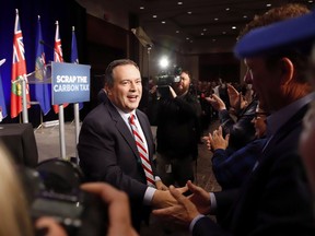 United Conservative Party Leader Jason Kenney greets supporters at an anti-carbon tax rally in Calgary, Friday, Oct. 5, 2018. Donations to Alberta's United Conservative Party far eclipsed that of the governing New Democrats last year. Figures from Elections Alberta show the UCP brought in $6.7 million in 2018 to the NDP's $3.4 million.