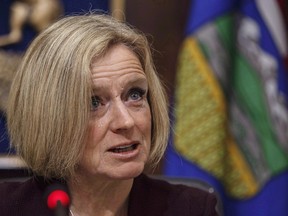 Alberta Premier Rachel Notley speaks to cabinet members in Edmonton on Monday December 3, 2018. Notley says a member of her caucus who is being accused of directing a civil servant to do party work on government time maintains he didn't do it.