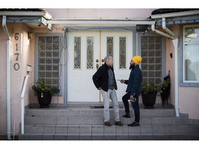 NDP Leader Jagmeet Singh, right, speaks with Paul Pelletreau while door knocking for his byelection campaign, in Burnaby, B.C., on Saturday January 12, 2019. Singh often starts conversations with Burnaby South residents by asking a question: "I want to take on the government in Ottawa. What do you need me to do?"