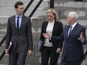 White House Senior Adviser Jared Kushner, left, Homeland Security Secretary Kirstjen Nielsen, and Vice President Mike Pence, talk as they walk down the steps of the Eisenhower Executive Office Building on the White House complex, Saturday, Jan. 5, 2019, in Washington.