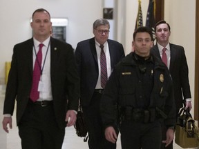 Attorney General nominee William Barr , second from left, arrives to meet with Sen. Ben Sasse, R-Neb., on Capitol Hill, Wednesday, Jan. 9, 2019 in Washington.