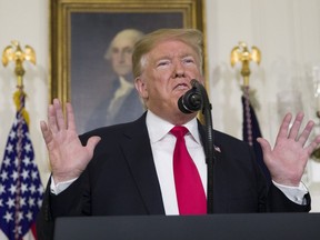 President Donald Trump speaks about the partial government shutdown, immigration and border security in the Diplomatic Reception Room of the White House, in Washington, Saturday, Jan. 19, 2019.