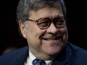 Attorney General nominee William Barr smiles as he arrives to testify before the Senate Judiciary Committee on Capitol Hill in Washington, Tuesday, Jan. 15, 2019. Barr will face questions from the Senate Judiciary Committee on Tuesday about his relationship with Trump, his views on executive powers and whether he can fairly oversee the special counsel's Russia investigation. Barr served as attorney general under George H.W. Bush.